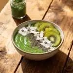 Green spirulina smoothie bowl with kiwi, chia seeds, and coconut flakes – Spirulina Recipes Breakfast